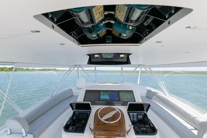 Slide: The Image of 2017 Viking 72 Convertible yacht helm with advanced navigation systems. - 10
