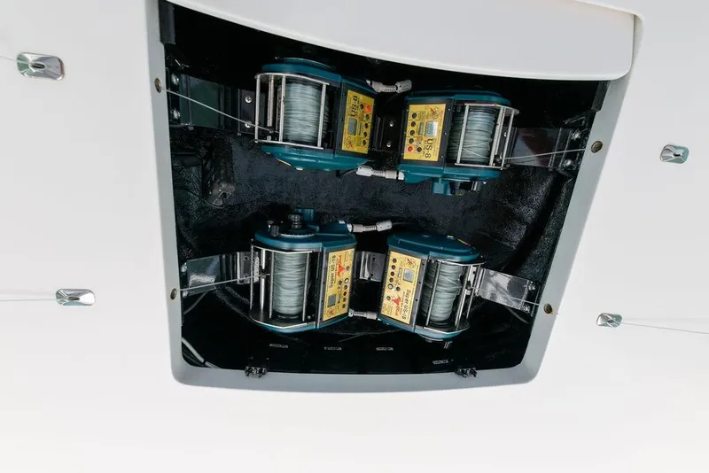 Slide: The Image of 2017 Viking 72 Convertible fishing reel system in boat compartment. - 11