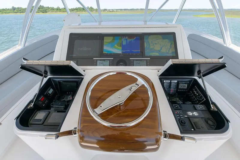Slide: The Image of 2017 Viking 72 Convertible yacht helm with advanced navigation systems. - 12