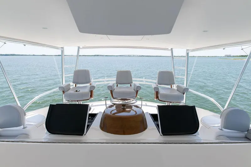 Slide: The Image of 2017 Viking 72 Convertible yacht helm station with ocean view. - 13