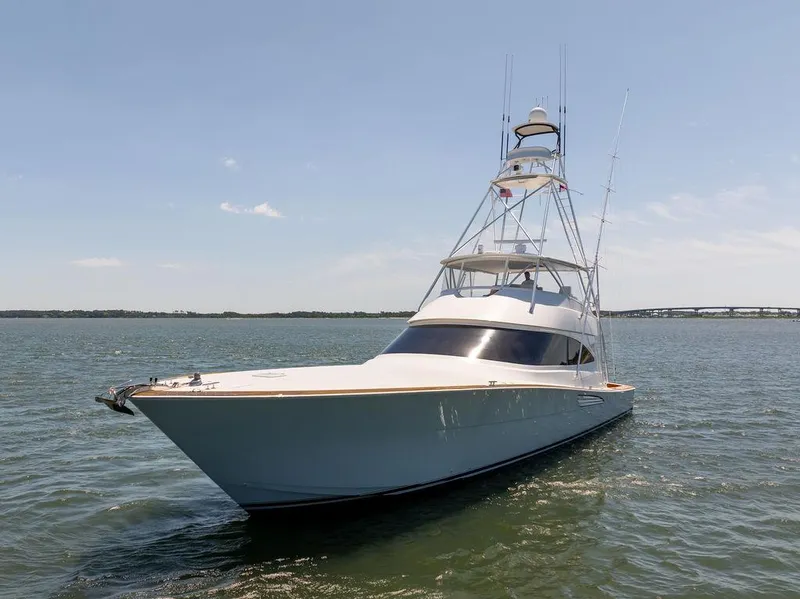 Slide: The Image of 2017 Viking 72 Convertible yacht on open water. - 2