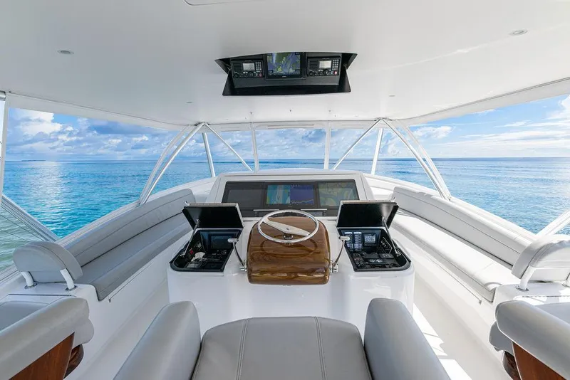 Slide: The Image of 2017 Viking 72 Convertible yacht helm with ocean view. - 6