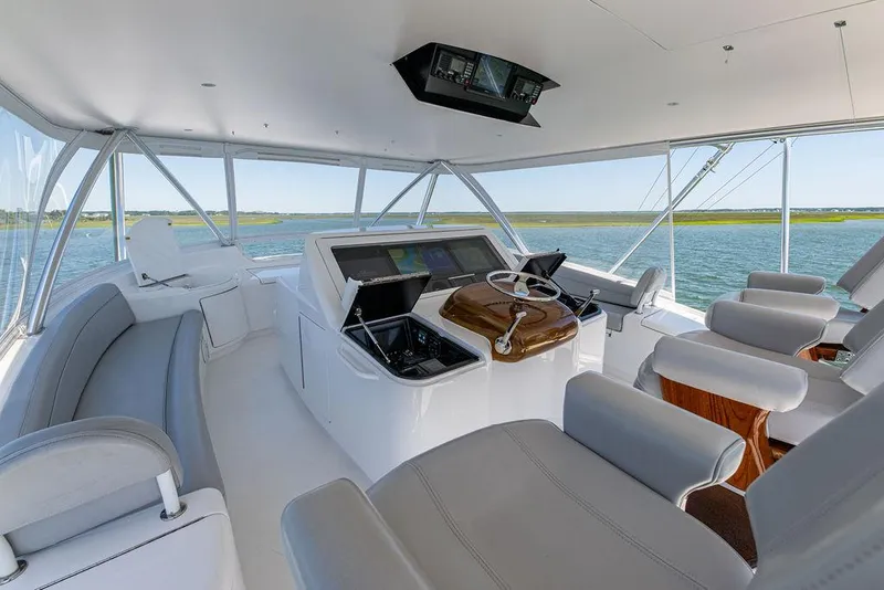 Slide: The Image of 2017 Viking 72 Convertible yacht helm station with panoramic views. - 7