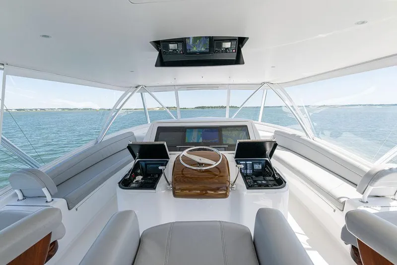 Slide: The Image of 2017 Viking 72 Convertible yacht helm with panoramic ocean view. - 9