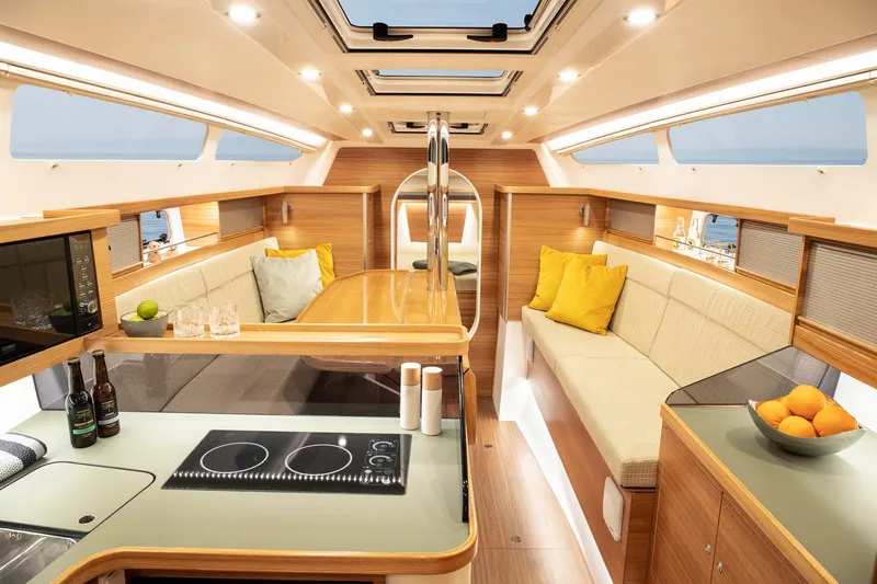 Slide: The Image of Luxurious interior of 2026 Dragonfly 40 yacht with modern kitchen and cozy seating. - 8