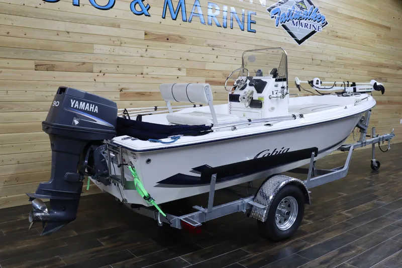 Slide: The Image of 2002 Cobia 174 Center Console boat with Yamaha 90 engine on trailer. - 3