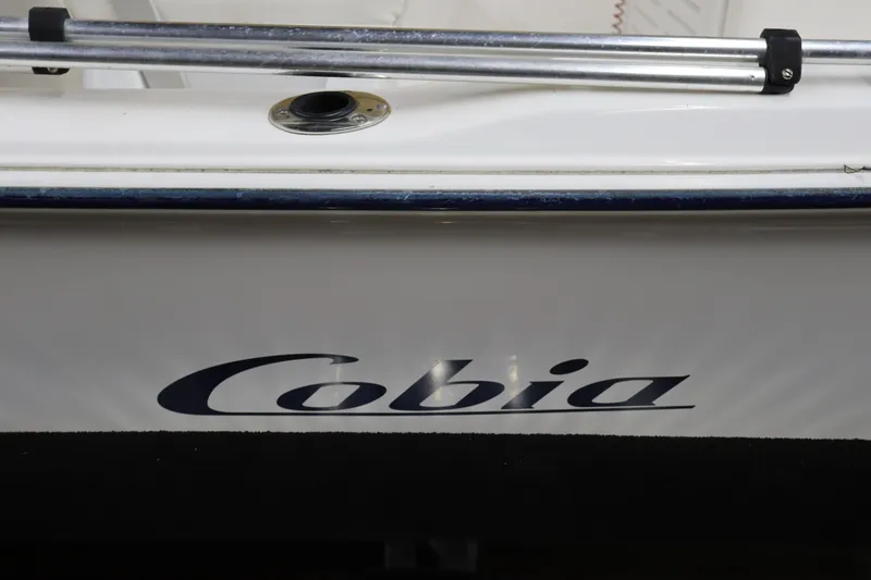 Slide: The Image of 2002 Cobia 174 Center Console boat side view with logo. - 6