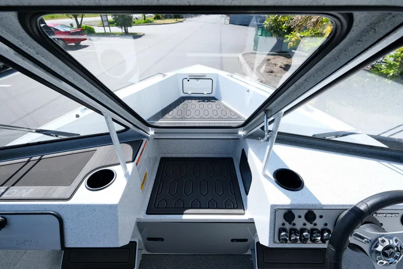 Slide: The Image of 2024 KingFisher 1825 Falcon boat interior with modern dashboard and controls. - 14
