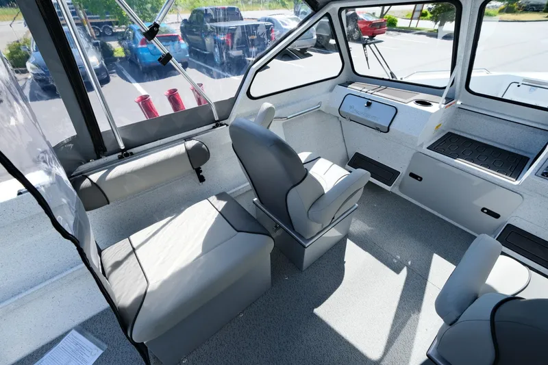 Slide: The Image of Interior of 2024 KingFisher 1825 Falcon boat with seating and dashboard. - 9
