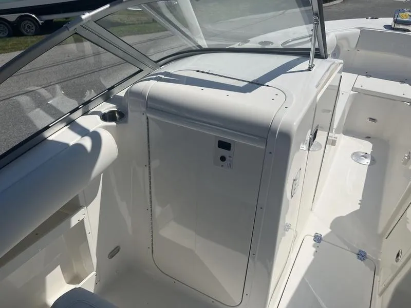 Slide: The Image of 2025 Key West 239 DFS boat interior with sleek white design and modern features. - 11