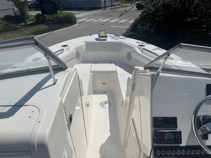 Slide: The Image of 2025 Key West 239 DFS boat interior with open deck and steering console. - 12