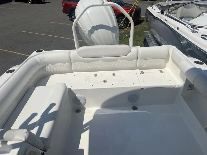 Slide: The Image of 2025 Key West 239 DFS boat interior with white seating and spacious deck. - 7