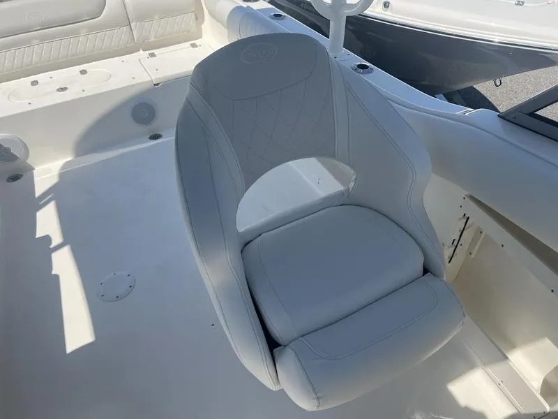Slide: The Image of 2025 Key West 239 DFS boat seat, white upholstery, spacious deck area. - 8