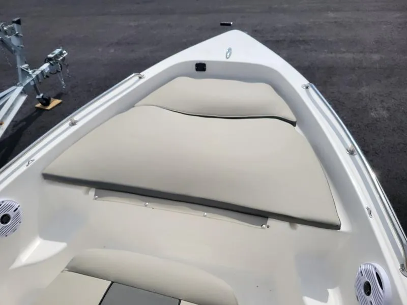 Slide: The Image of 2025 Key West 1720 CC boat interior with cushioned seating and speakers. - 1