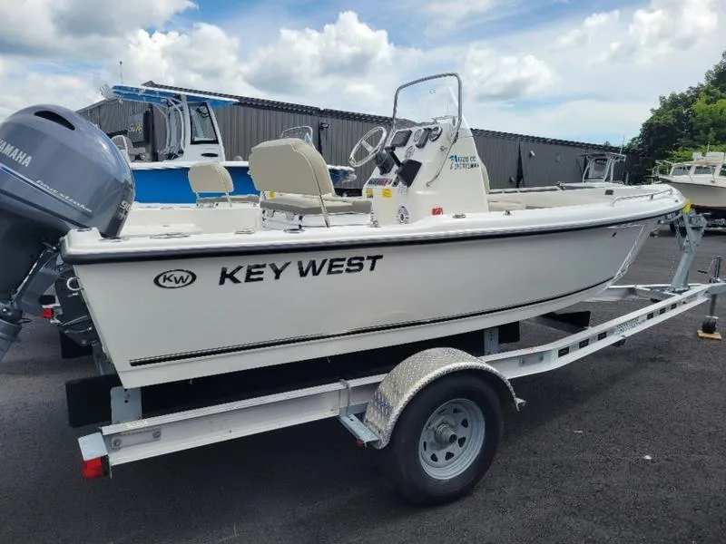 Slide: The Image of 2025 Key West 1720 CC boat on trailer, featuring Yamaha outboard motor. - 2