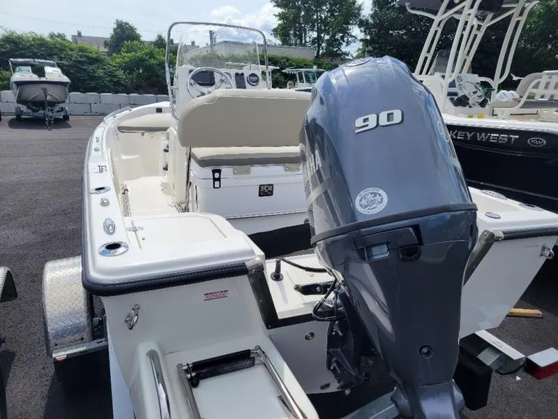 Slide: The Image of 2025 Key West 1720 CC boat with 90 HP engine, parked outdoors. - 4