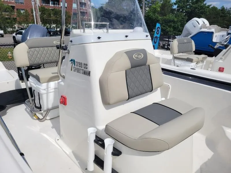 Slide: The Image of 2025 Key West 1720 CC boat interior with cushioned seating and console. - 8
