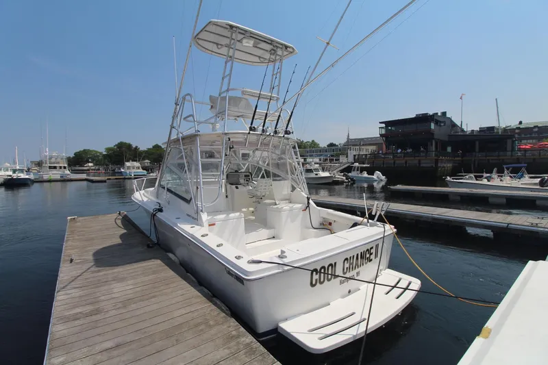 Slide: The Image of 2007 Luhrs 28 Open boat docked at marina, rear view. - 2