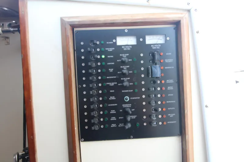 Slide: The Image of Electrical panel on 2007 Luhrs 28 Open boat, featuring switches and meters. - 20