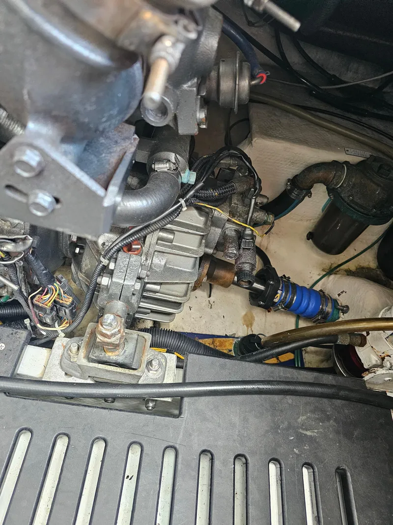 Slide: The Image of Engine compartment of a 2007 Luhrs 28 Open boat, showcasing mechanical components. - 24