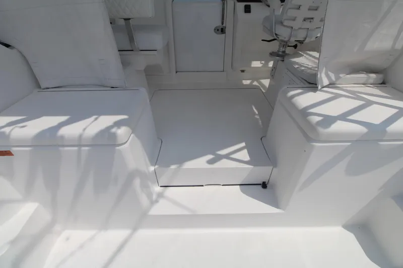 Slide: The Image of 2007 Luhrs 28 Open boat interior with white seating and helm area. - 6
