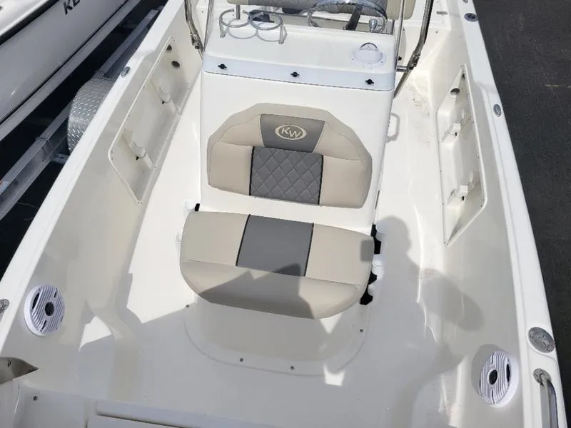 Slide: The Image of 2025 Key West 1720 CC boat interior with beige seating and console. - 10