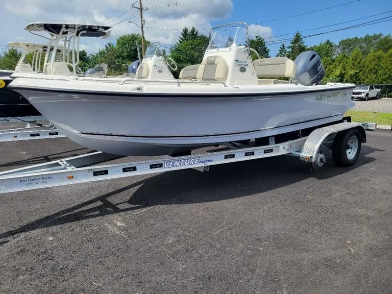 Slide: The Image of 2025 Key West 1720 CC boat on trailer, parked outdoors. - 3