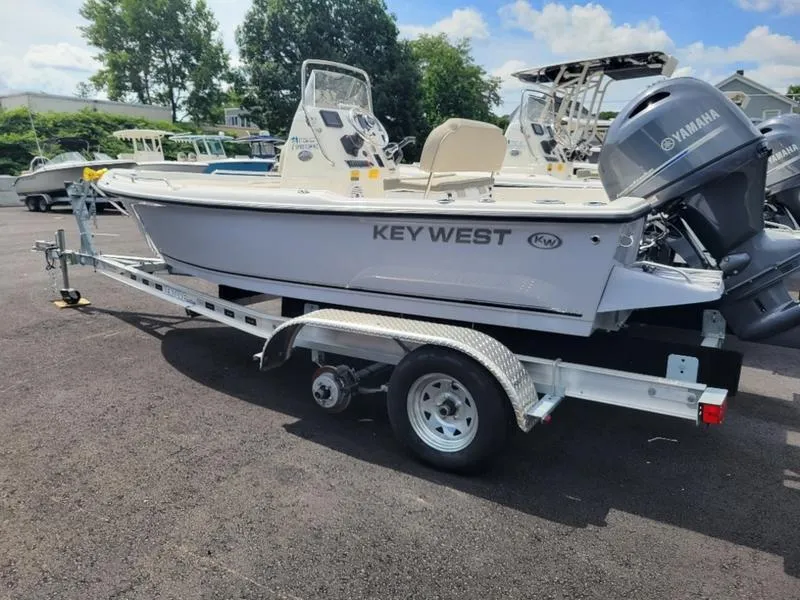 Slide: The Image of 2025 Key West 1720 CC boat on trailer, featuring Yamaha outboard motor. - 4