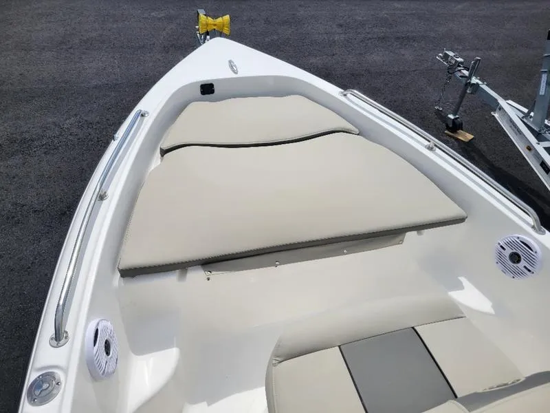 Slide: The Image of 2025 Key West 1720 CC boat interior with cushioned seating and speakers. - 8