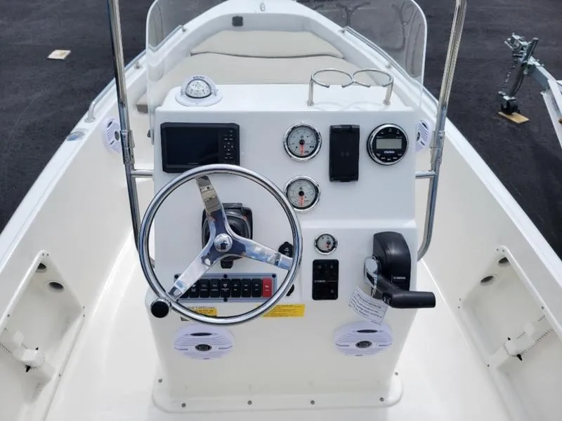 Slide: The Image of 2025 Key West 1720 CC boat console with steering wheel and gauges. - 9