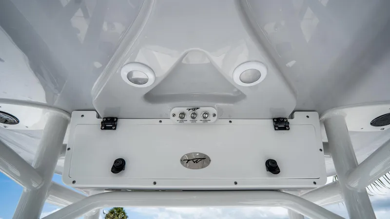 Slide: The Image of 2025 Tidewater 2300 Carolina Bay boat console with controls and speakers. - 12