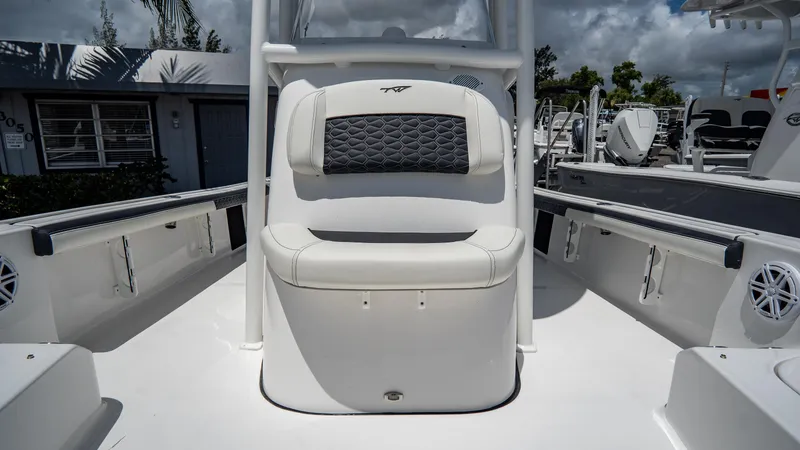 Slide: The Image of 2025 Tidewater 2300 Carolina Bay boat interior with cushioned seating. - 14