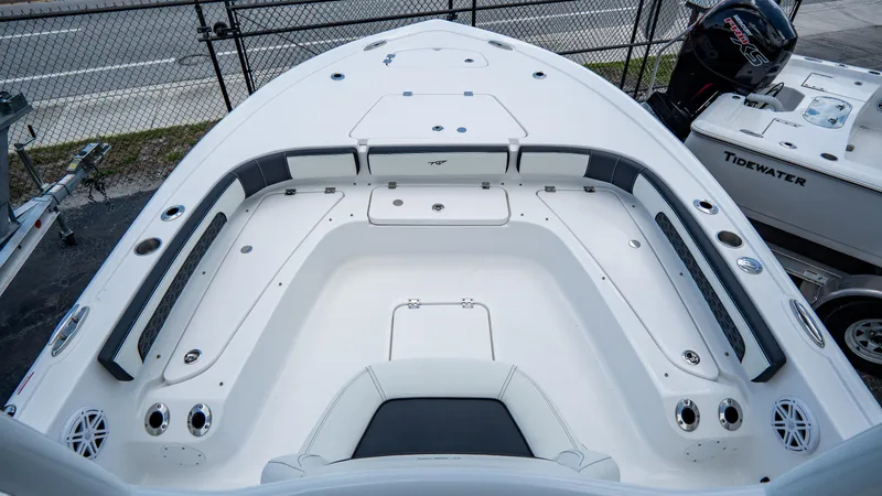 Slide: The Image of 2025 Tidewater 2300 Carolina Bay boat interior with seating and storage compartments. - 15