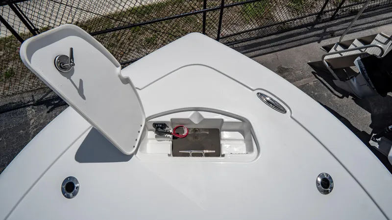 Slide: The Image of 2025 Tidewater 2300 Carolina Bay boat storage compartment with open hatch. - 19