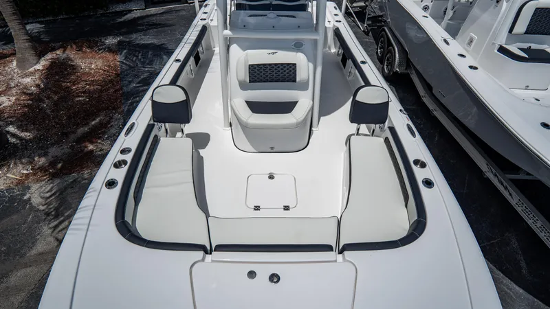 Slide: The Image of 2025 Tidewater 2300 Carolina Bay boat interior with seating and storage compartments. - 21