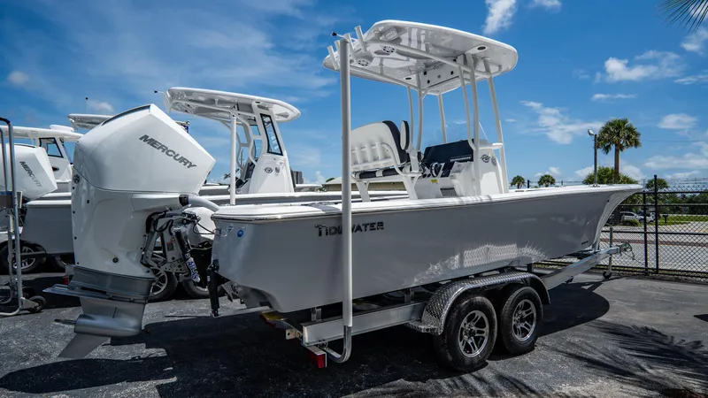 Slide: The Image of 2025 Tidewater 2300 Carolina Bay boat on a trailer with Mercury outboard motor. - 3