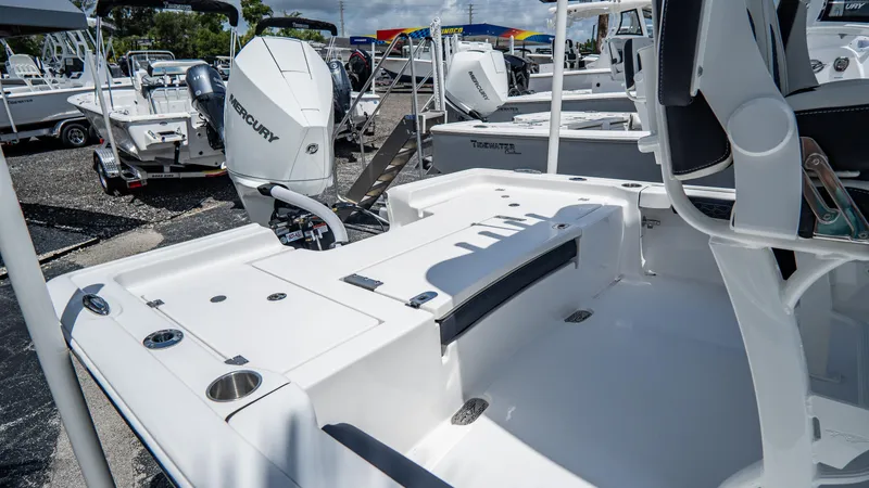 Slide: The Image of 2025 Tidewater 2300 Carolina Bay boat with Mercury outboard engine. - 4