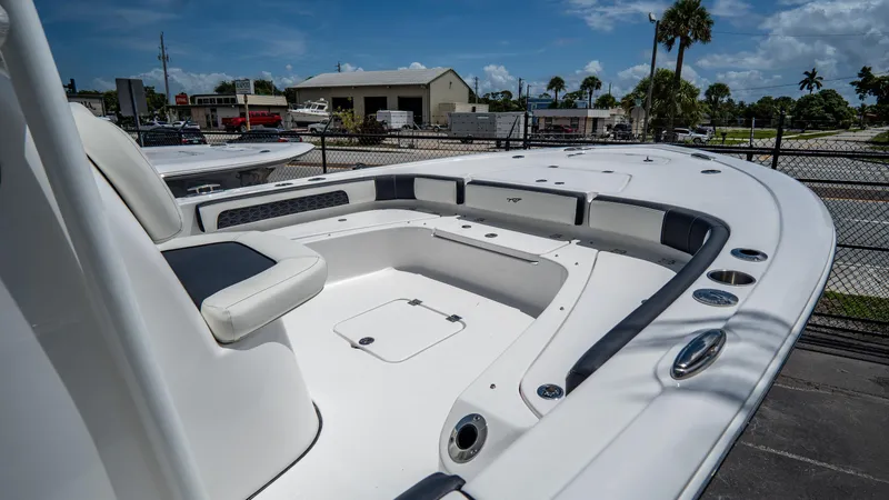 Slide: The Image of 2025 Tidewater 2300 Carolina Bay boat interior with seating and storage compartments. - 5