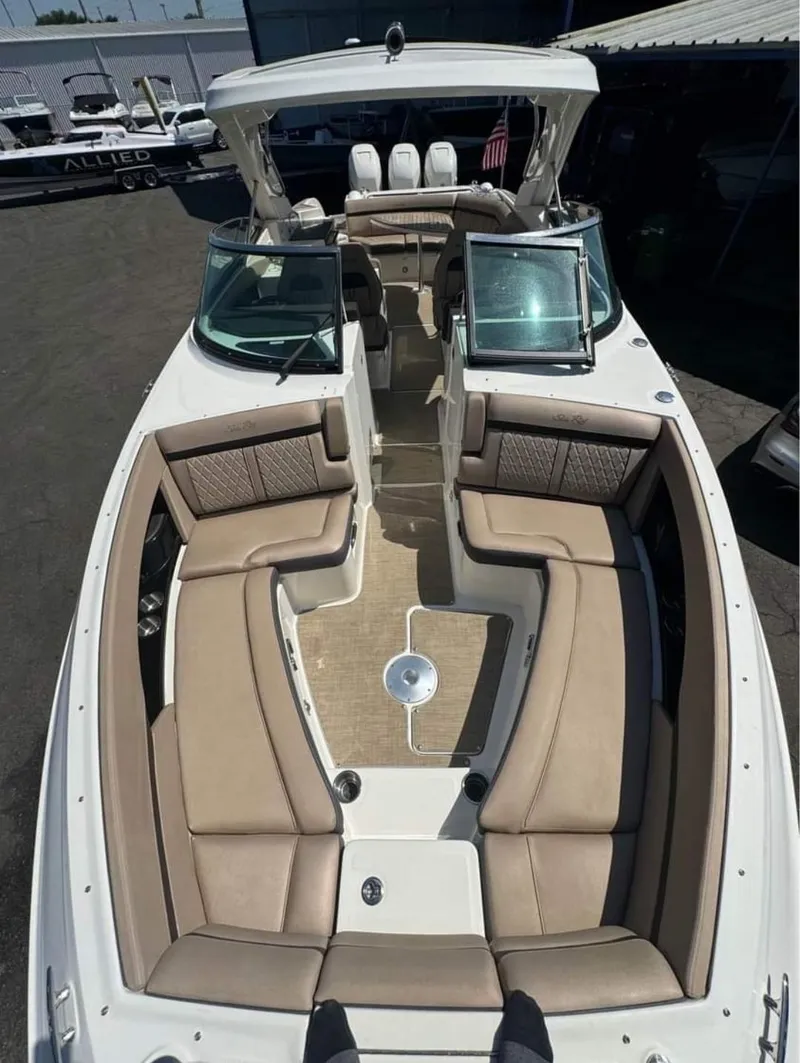 Slide: The Image of 2018 Sea Ray SLX 350 OB boat with spacious seating and modern design. - 15