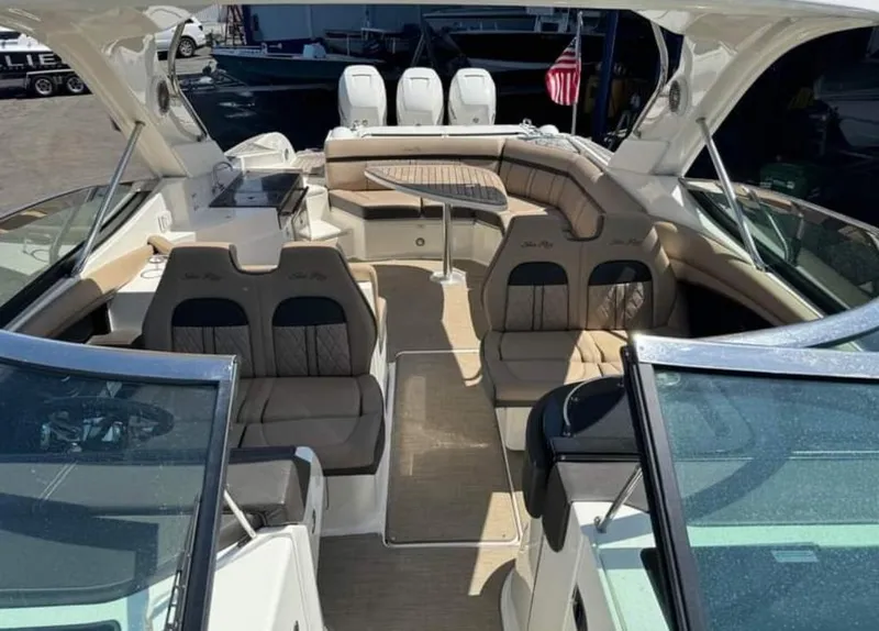 Slide: The Image of 2018 Sea Ray SLX 350 OB boat interior with seating and table. - 17