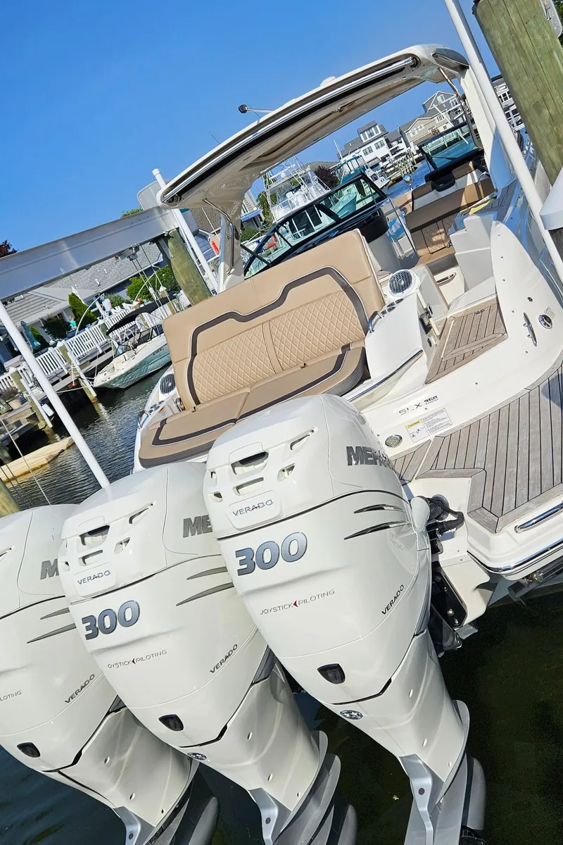 Slide: The Image of 2018 Sea Ray SLX 350 OB with triple Mercury 300 outboard engines. - 18