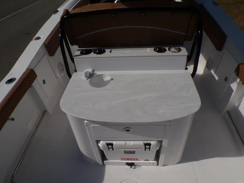 Slide: The Image of 2025 Sea Hunt Ultra 305 SE boat interior with seating and storage. - 15