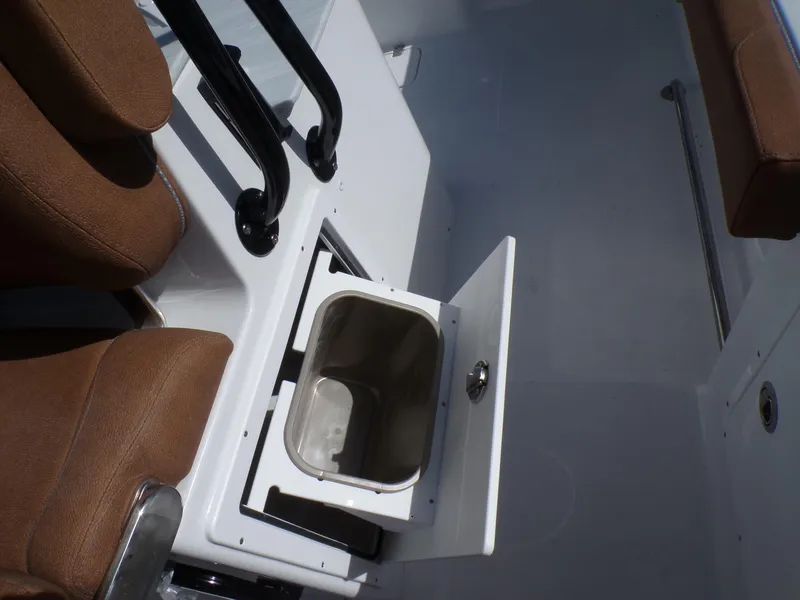 Slide: The Image of 2025 Sea Hunt Ultra 305 SE boat interior with storage compartment. - 19
