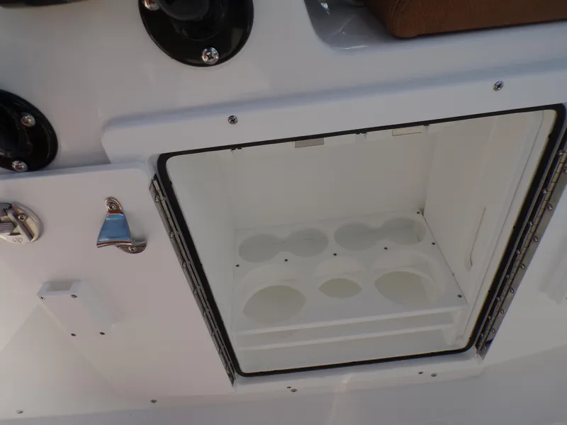 Slide: The Image of Open storage compartment on a 2025 Sea Hunt Ultra 305 SE boat. - 20