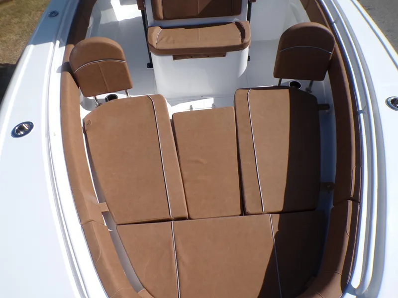 Slide: The Image of 2025 Sea Hunt Ultra 305 SE boat with brown cushioned seating. - 5