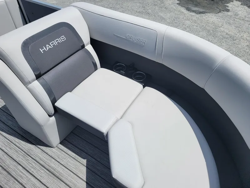 Slide: The Image of 2025 Harris Cruiser 210 boat interior with comfortable seating and cup holders. - 10