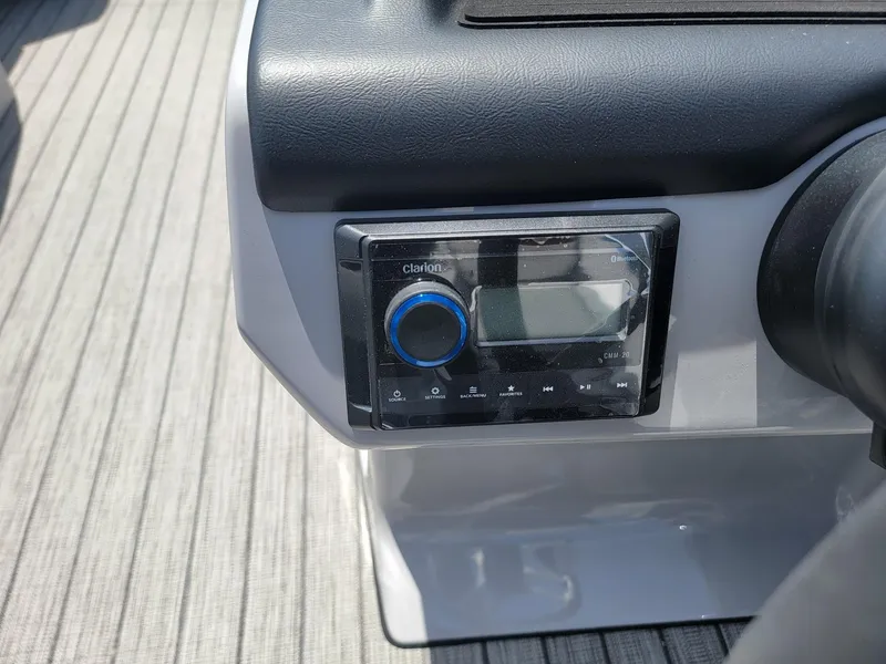 Slide: The Image of Close-up of the control panel on a 2025 Harris Cruiser 210 boat. - 15
