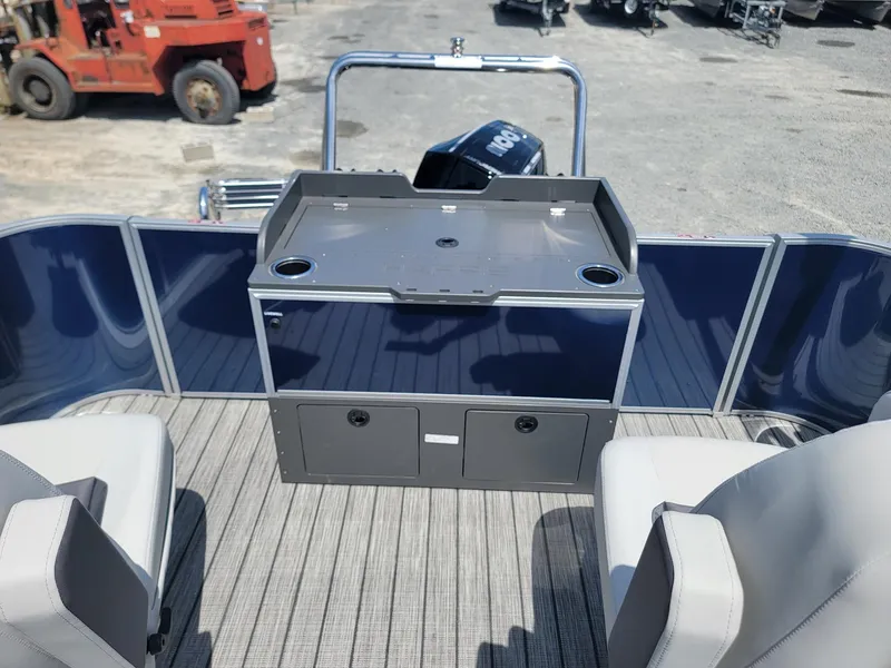 Slide: The Image of 2025 Harris Cruiser 210 boat interior with seating and storage compartments. - 19
