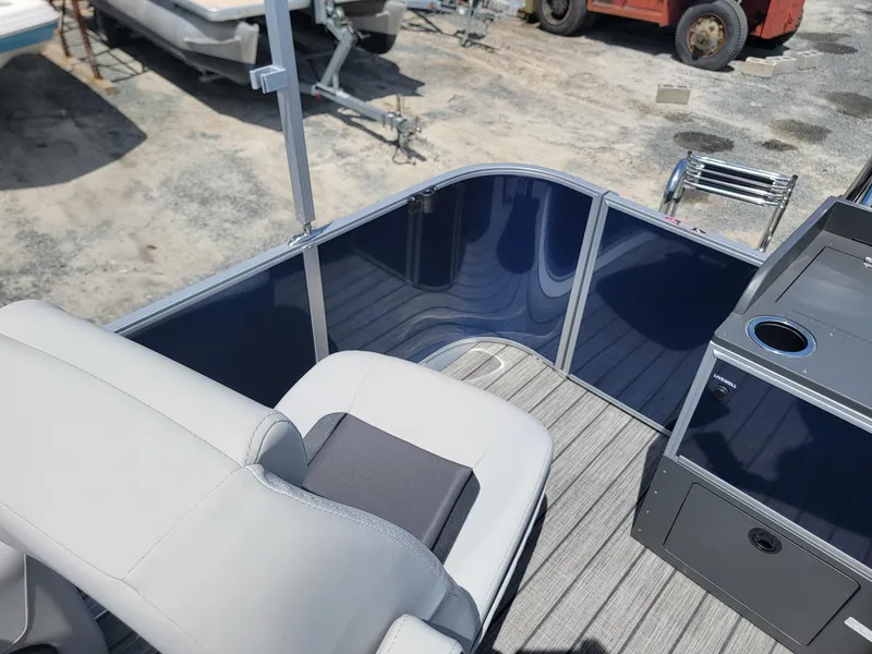 Slide: The Image of 2025 Harris Cruiser 210 boat interior with seating and storage compartments. - 20