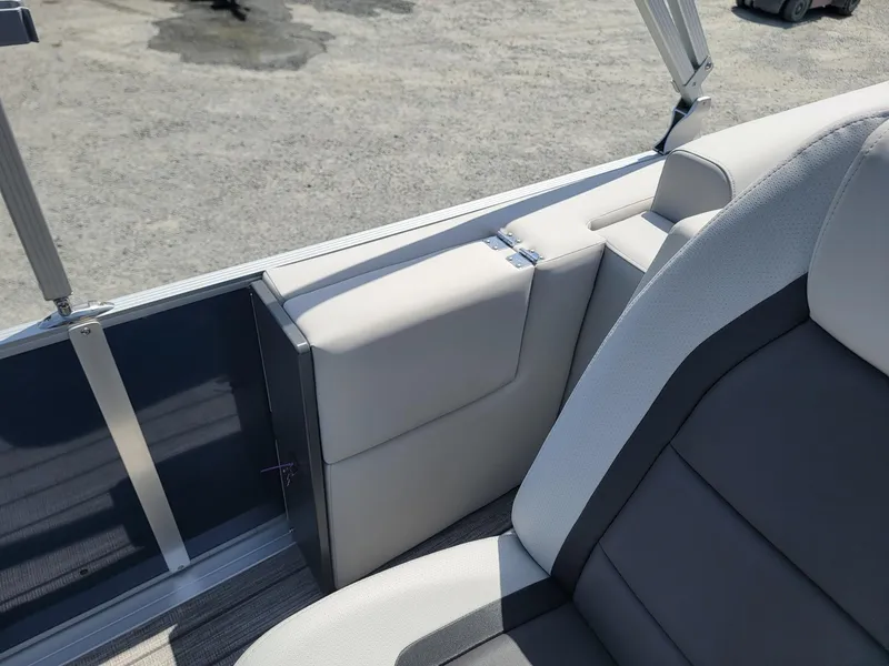 Slide: The Image of 2025 Harris Cruiser 210 boat interior with gray and white seating. - 24